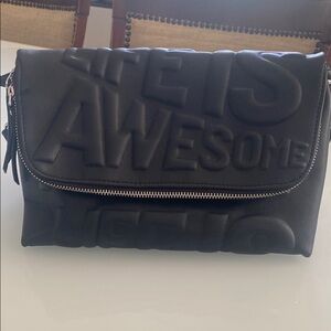 Black Messenger/crossbody Bag Embossed Text and Flap Closure with many pockets